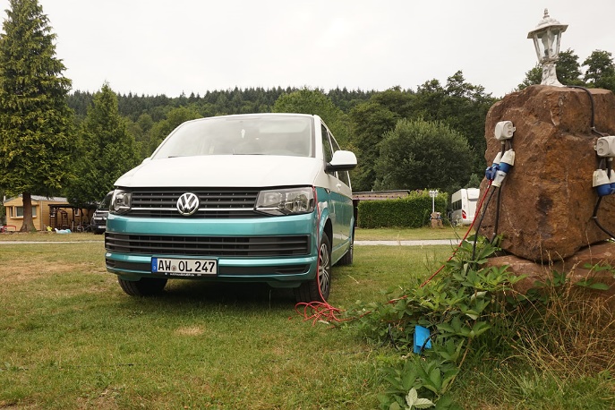 A car parked in a grassy yard

Description automatically generated