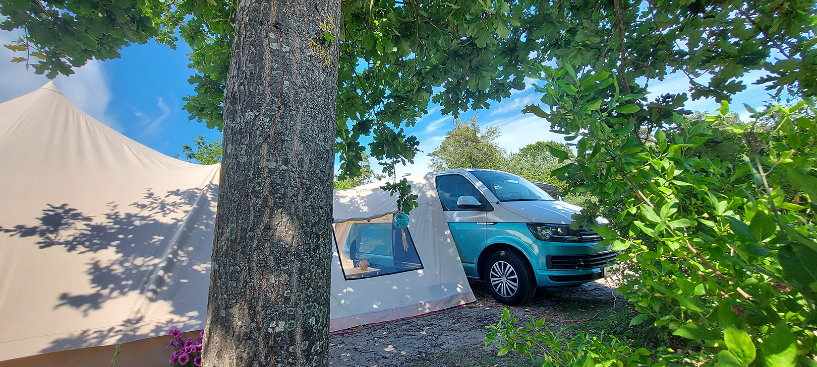 A van with a tent in the front

Description automatically generated with medium confidence